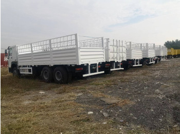 SINOTRUK HOWO DUMP TRUCK WITH FENCE LIVESTOCK TRUCK - Tipper