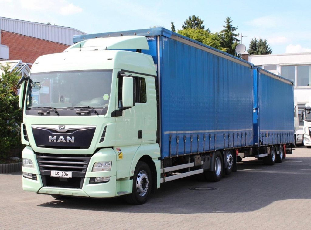 MAN TGX 26.460 Retarder Jumbo-Zug 120M3 Durchlade - Curtainsider truck: picture 1 MAN TGX 26.460 Retarder Jumbo-Zug 120M3 Durchlade - Curtainsider truck: picture 1