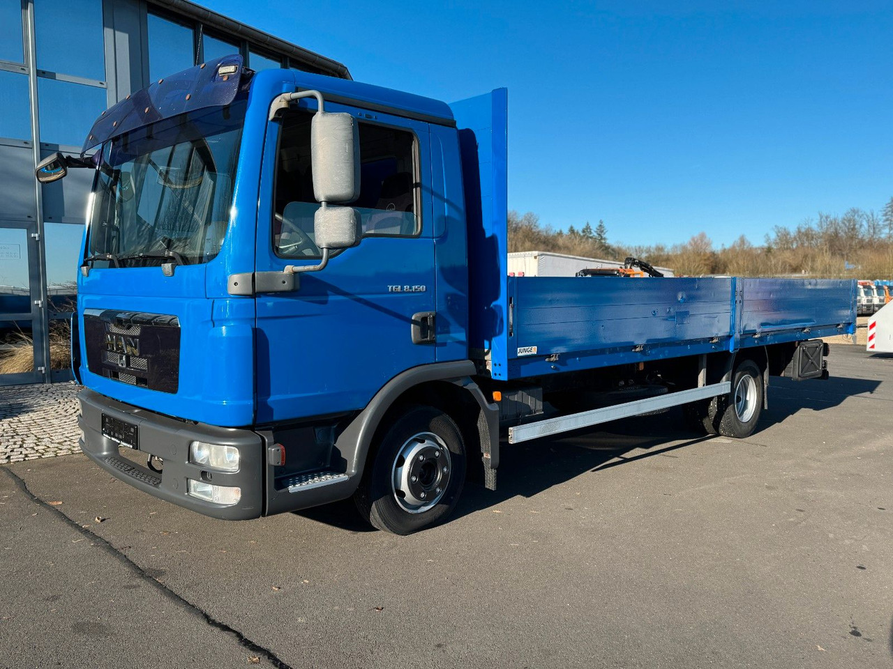 MAN TGL 8.150 Pritsche AHK + Blattfederung MAN TGL 8.150 Pritsche AHK + Blattfederung - Flatbed van: picture 1 MAN TGL 8.150 Pritsche AHK + Blattfederung MAN TGL 8.150 Pritsche AHK + Blattfederung - Flatbed van: picture 1