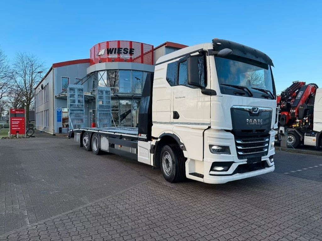 MAN Baumaschinen- Arbeitsbühnentransporter Rampen - Dropside/ Flatbed truck: picture 1 MAN Baumaschinen- Arbeitsbühnentransporter Rampen - Dropside/ Flatbed truck: picture 1