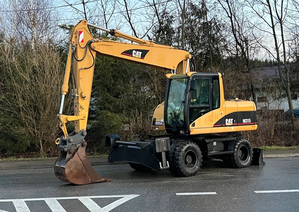 Caterpillar CAT M315C CATERPILLAR SPROWADZONY Bardzo Dobry Stan - Wheel excavator: picture 1 Caterpillar CAT M315C CATERPILLAR SPROWADZONY Bardzo Dobry Stan - Wheel excavator: picture 1