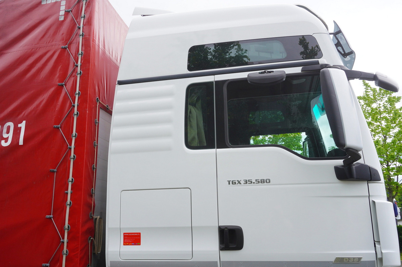 Curtainsider truck MAN TGX 35.580 E6 8x4 /4 / 23 EPAL tarp superstructure / 4th axle steered: picture 14 Curtainsider truck MAN TGX 35.580 E6 8x4 /4 / 23 EPAL tarp superstructure / 4th axle steered: picture 14