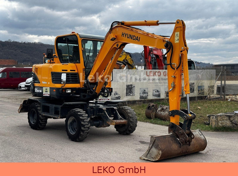 Hyundai Robex 55W-9A Mit Drei Löffeln - Wheel excavator: picture 1 Hyundai Robex 55W-9A Mit Drei Löffeln - Wheel excavator: picture 1