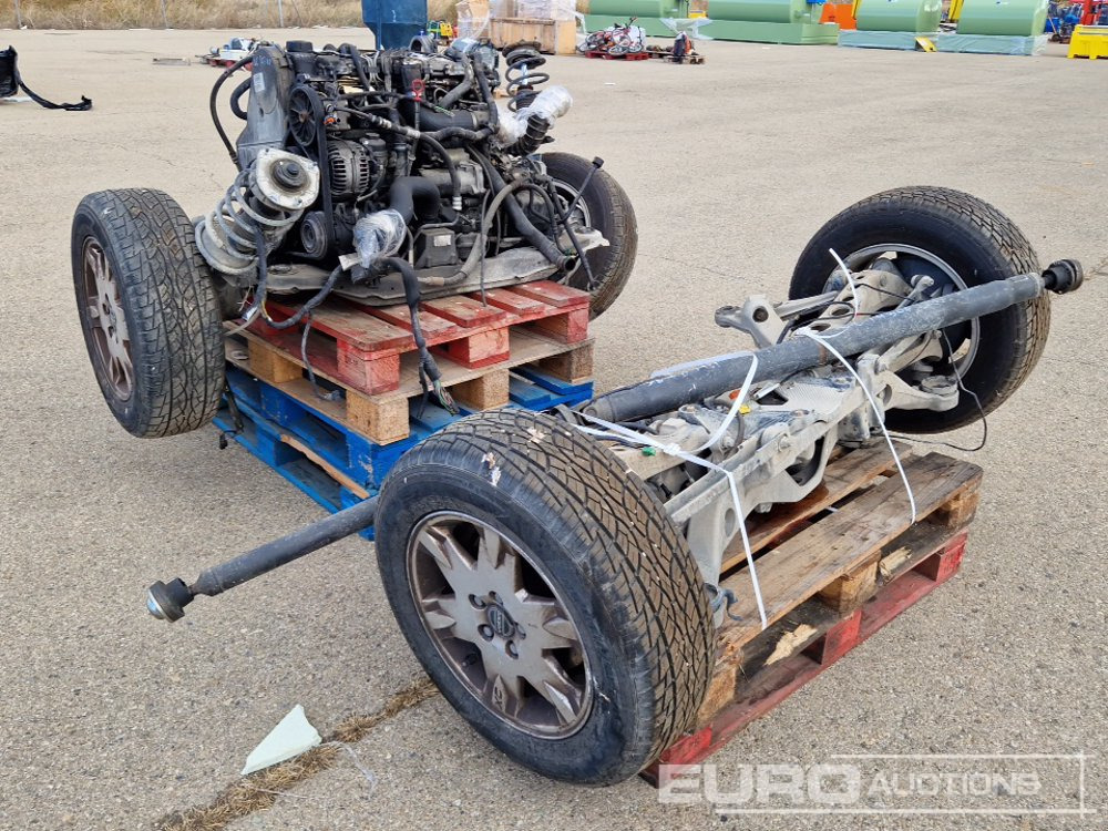 Pallet of Volvo XC70 Spares including Axles, Tyres, Engine components - Construction equipment: picture 1 Pallet of Volvo XC70 Spares including Axles, Tyres, Engine components - Construction equipment: picture 1