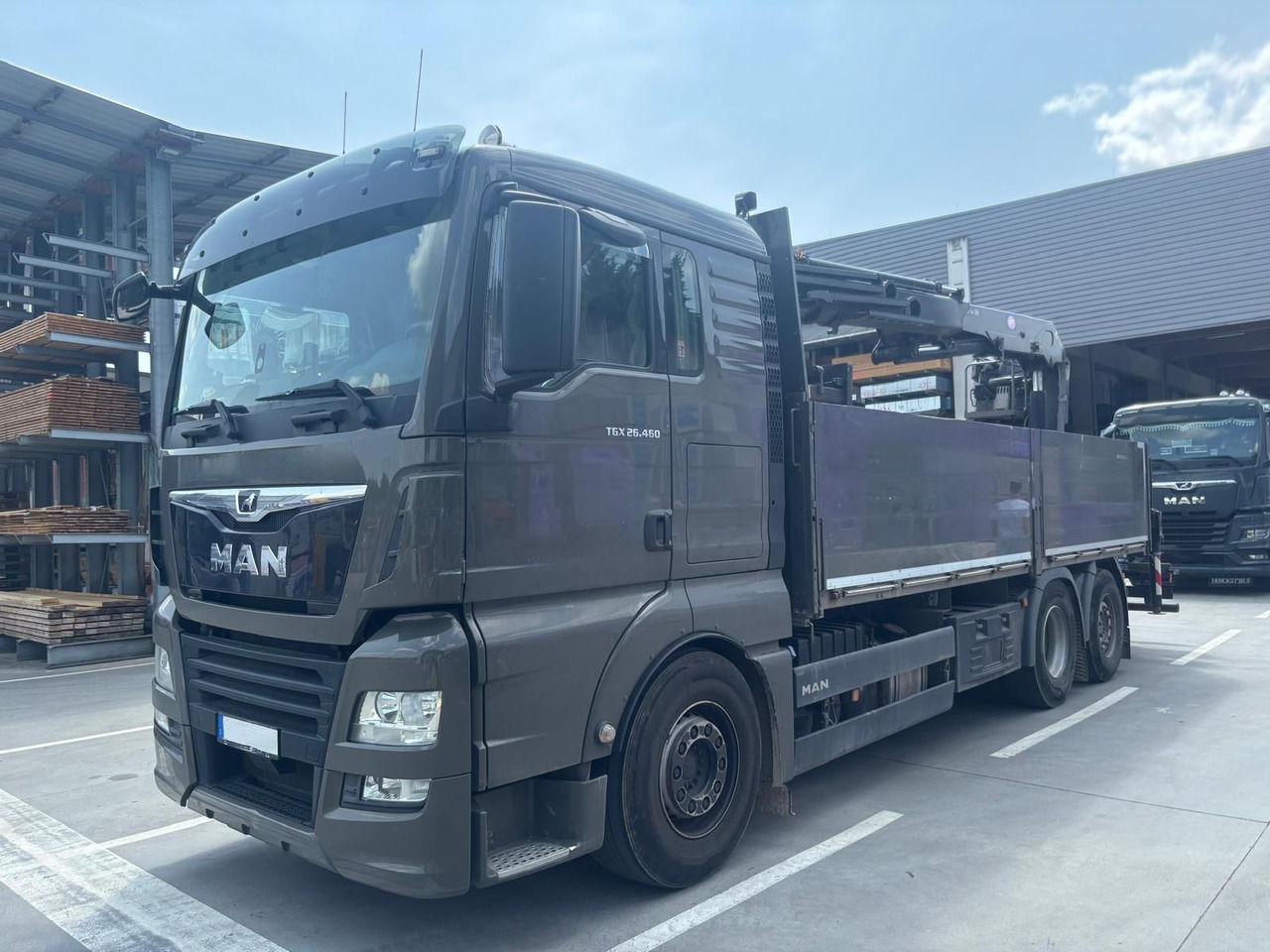 MAN 26.460 TGX Baustoffkran HMF 2110-L3 - Crane truck: picture 1 MAN 26.460 TGX Baustoffkran HMF 2110-L3 - Crane truck: picture 1
